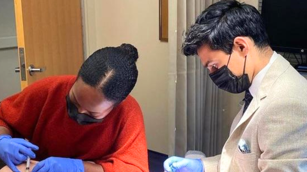 Dr. Hamid Dermatologist in Dayton, Ohio showing patient care